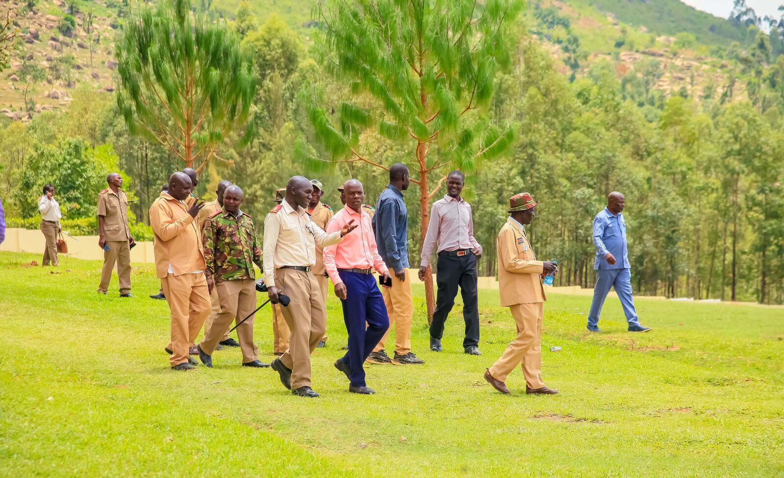 People walking outdoors on the campus grounds