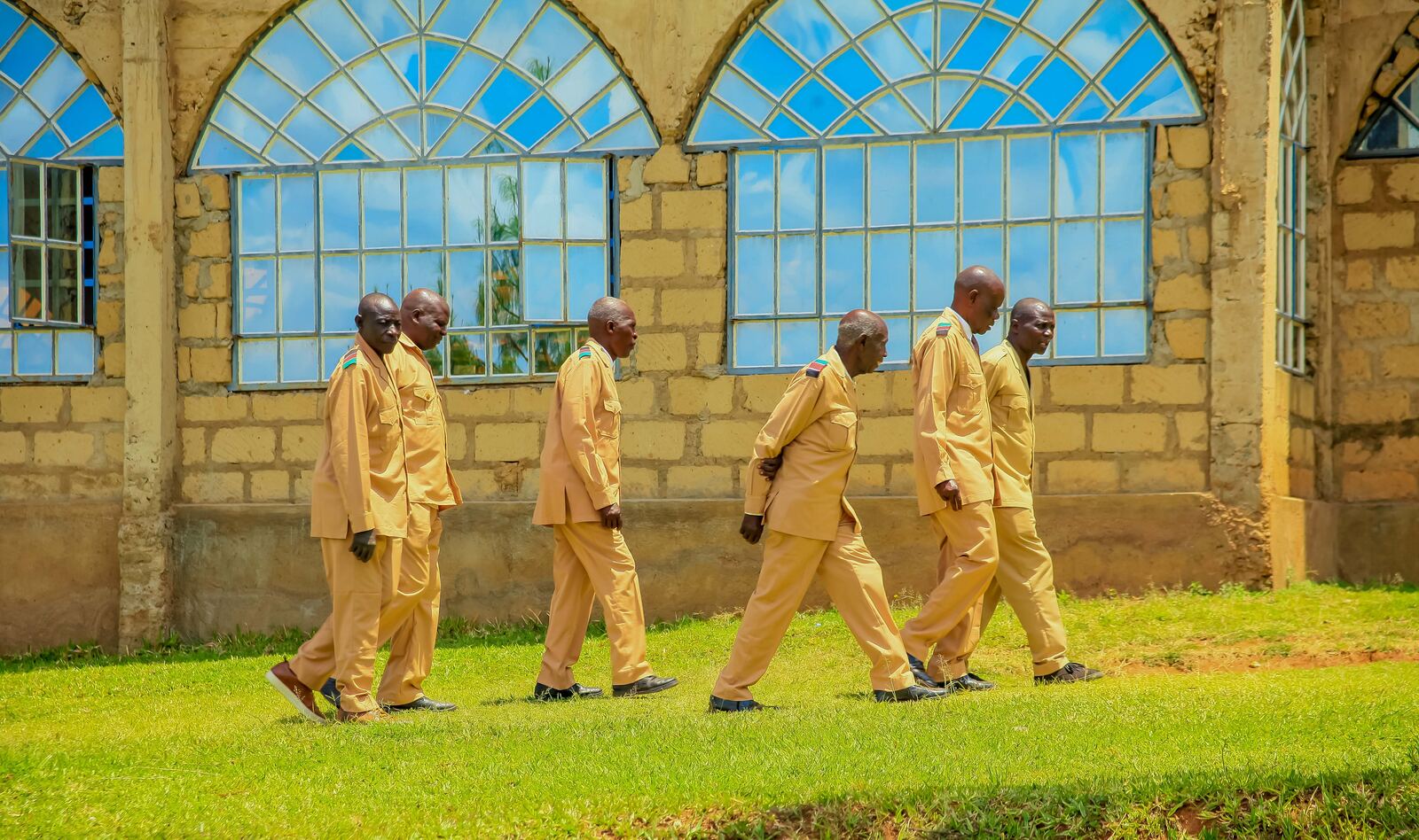 People walking across the campus grounds