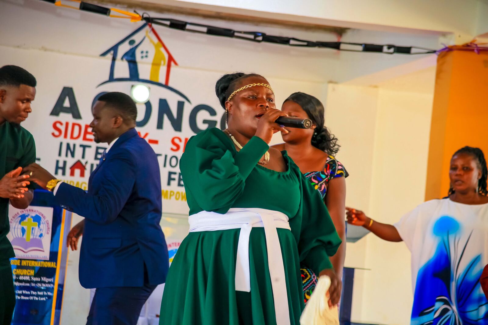 Singer leading worship on the church platform