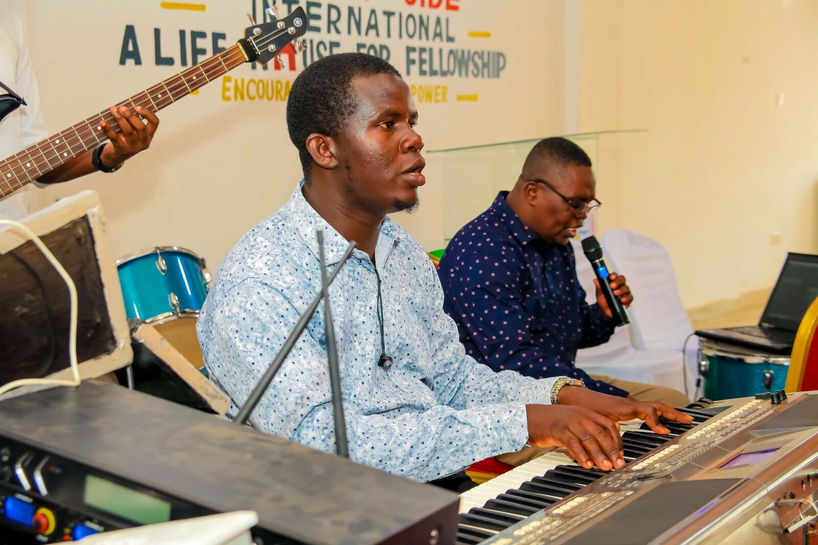 Keyboard player accompanying worship