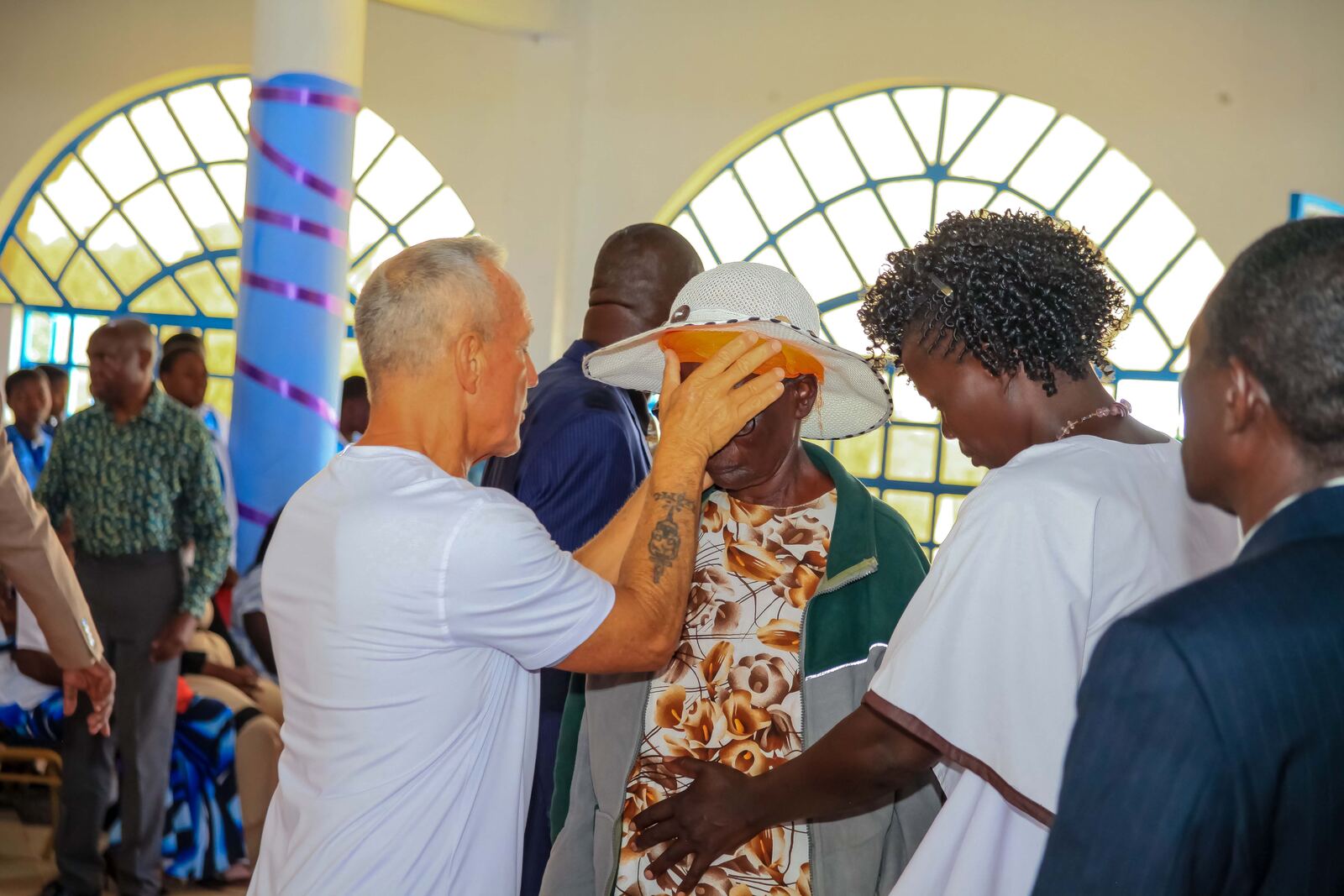 Church members praying together