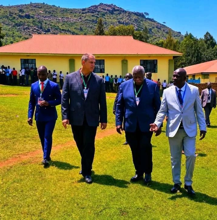 Official delegation walking across the school campus